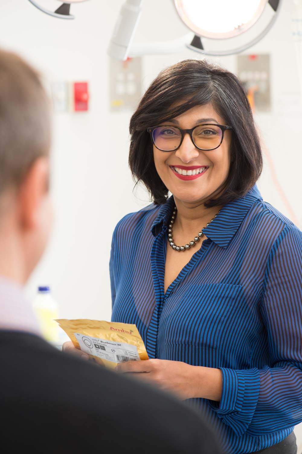 Urologist Dr Ashani Couchman smiling at a patient.